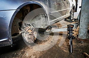 Repairman, worker changing car wheel.