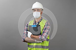 Repairman worker with clipboard. Worker man wearing face mask