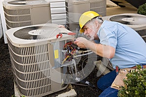 Repairman Working On Air Conditioner