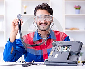 Repairman working in technical support fixing computer laptop tr