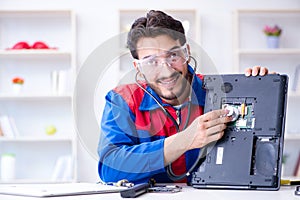 Repairman working in technical support fixing computer laptop tr