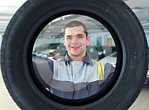 Repairmen automobile mechanic with car tire