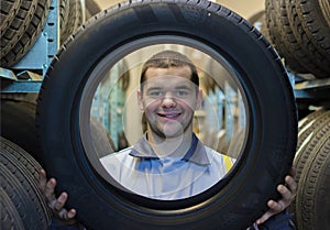 Repairmen automobile mechanic with car tire