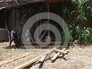 Repairs being made on a dog pen in the tropics