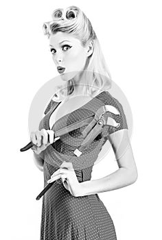 Repairwoman with instruments. Building and construction. Repairment tools. Pinup woman.