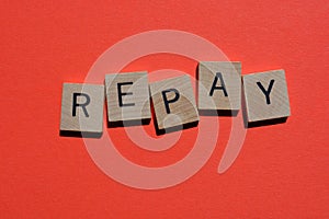 Repay, word isolated on red background photo