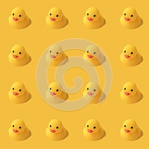 Repeatable pattern of yellow rubber duck on yellow background Modern style. creative photography