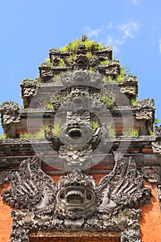 Repeated Balinese sculptures vertical