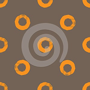 Repeated circles drawn a rough brush. Simple seamless pattern.