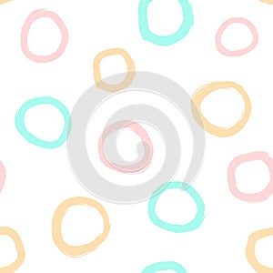 Repeated circles drawn with watercolour brush. Simple geometric seamless pattern for children.