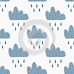 Repeated clouds with falling rain drops. Cute seamless pattern for children.