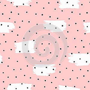 Repeated irregular polka dot and brush strokes painted with rough brush. Seamless pattern drawn by hand.