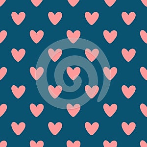 Repeated pink hearts on blue background. Cute seamless pattern.