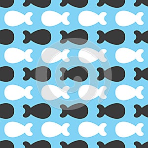 Repeating abstract silhouettes of small fish. Seamless pattern.