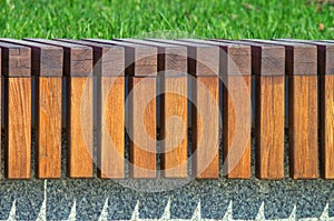 Repeating texture of wooden bars. Modern architecture bench in the city park