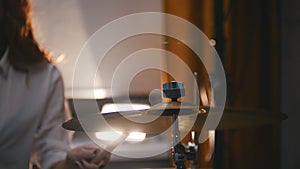 Repetition. Redhead girl plays on drums plates . Portrait. Backlights.