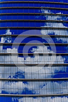 Repetitive horizontal louvers and reflective sky