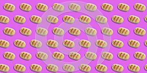 Repetitive pattern of marzipan on a pink background. christmas food concept