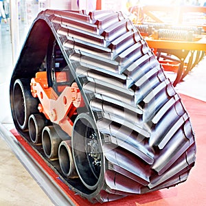 Replaceable continuous track drive for harvester