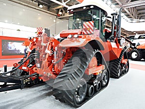 Replaceable continuous track drive for harvester