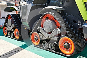 Replaceable continuous track drive for harvester