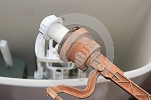 Replacement and cleaning toilet flush tank supplies, rusty damaged float mechanism close up