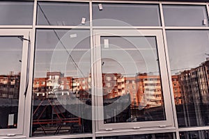 Replacement of double-glazed windows in shop windows, reconstruction of the supermarket facade, repair of windows