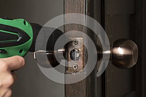 Replacement, installation of a wooden door lock