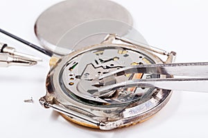 Replacing battery in quartz watch close up