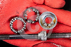 Replacing the bicycle wheel bearing. Bicycle parts service in the workshop