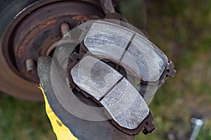 Replacing the brake pads in the car. Repair of the front suspension in the car