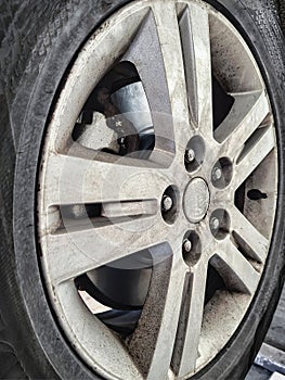 Replacing brake pads and discs in a car on a lift at a service center