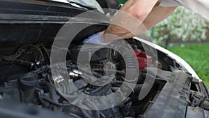 Replacing the car's air filter with a new one, mechanic replace a new filter after diagnostic