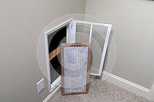 Replacing clean Air filter for home air conditioner photo