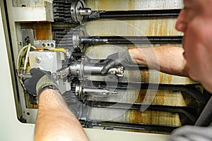 Replacing the cutting tool in the tool shop of a CNC milling machine