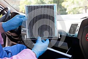 Replacing dirty cabin pollen air filter for a car