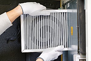 Replacing filter in the central ventilation system. hvac filter replacing home central air system