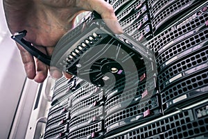 Replacing a module in a powerful server hardware. Cloud storage technology concept. Hosting platform of the Internet provider.