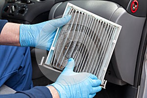 Replacing old and dirty car cabin air filter