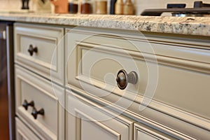 replacing old knobs on upcycled kitchen cabinets