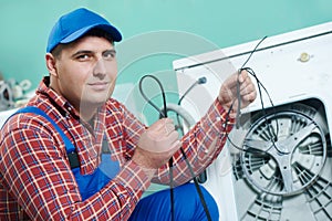 Replacing rubber drive belt of washing machine photo