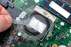 Replacing thermal paste on a laptop.