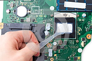 Replacing thermal paste on a laptop.