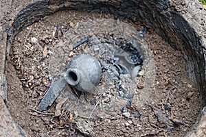 Replica of an ancient pit fire kiln ready for harvest of pottery after burning