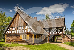 Replica of early 20th century hut with arcade extension, Olsztynek, Poland. photo