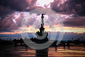 The replica of Michelangelos David statue in Michelangelo Square during sunset in Florence, Italy