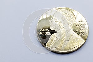 Replica of the Nobel Prize on a gray background