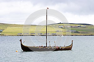 A replica Viking long boat in Lerwick harbour, Shetlands photo