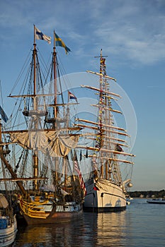 Replicas of Tall Ships in the Setting Sun