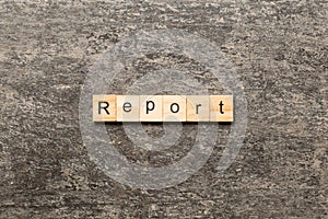 report word written on wood block. report text on table, concept